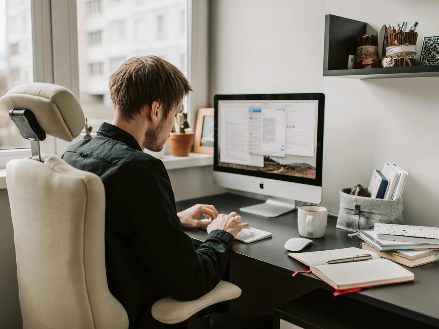 Man at desk working on computer