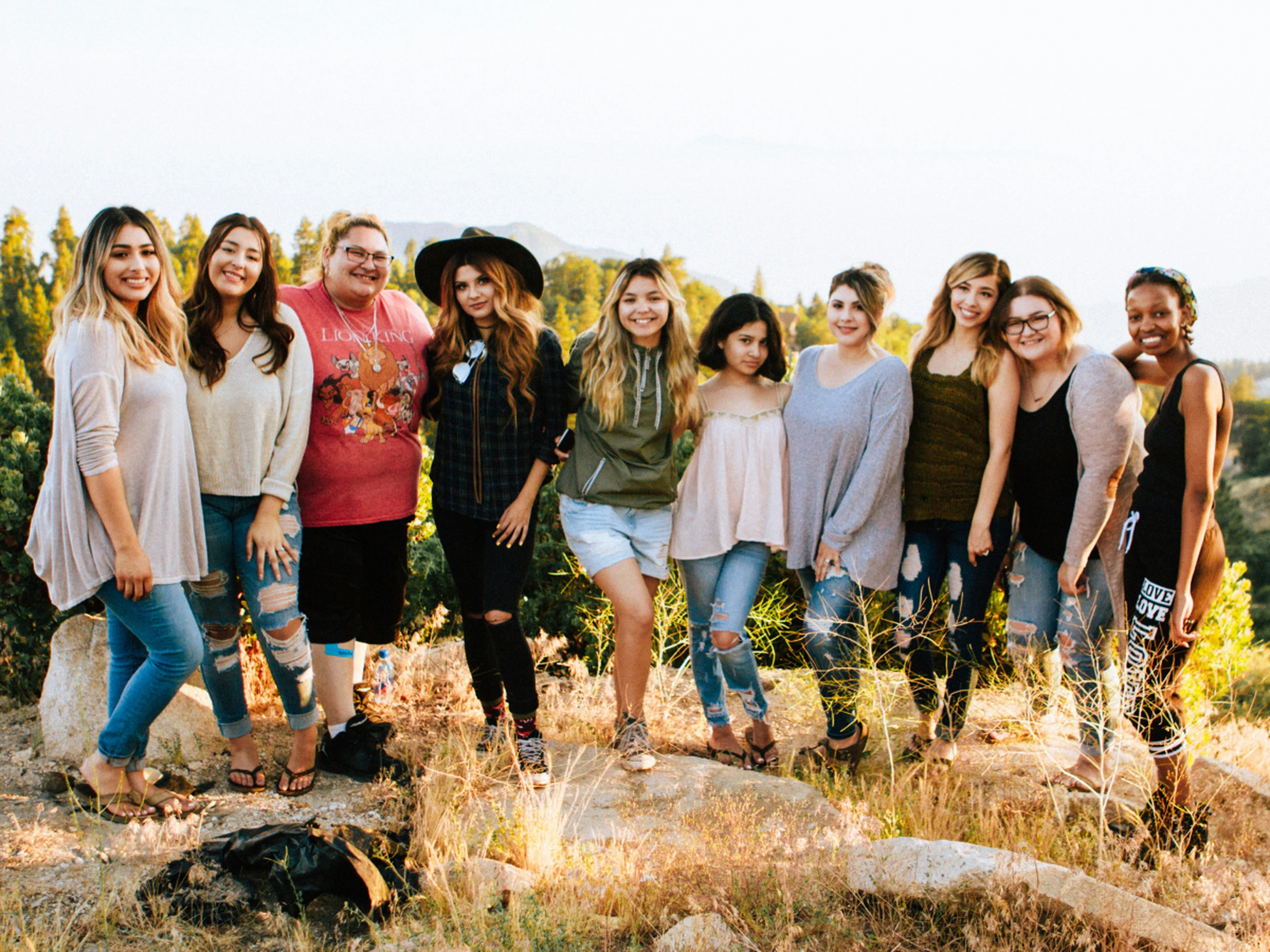 group of teenagers in nature posing for a picture