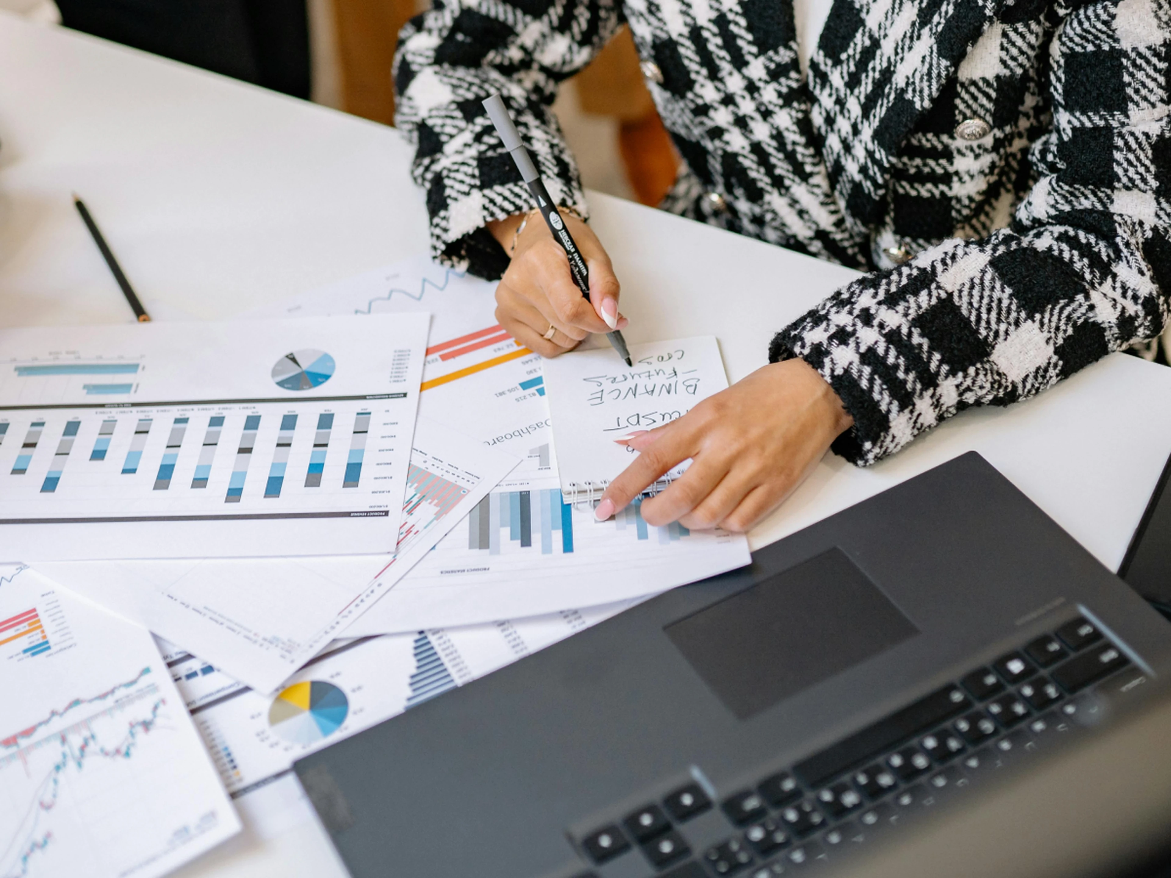 hotelier analyzing data charts