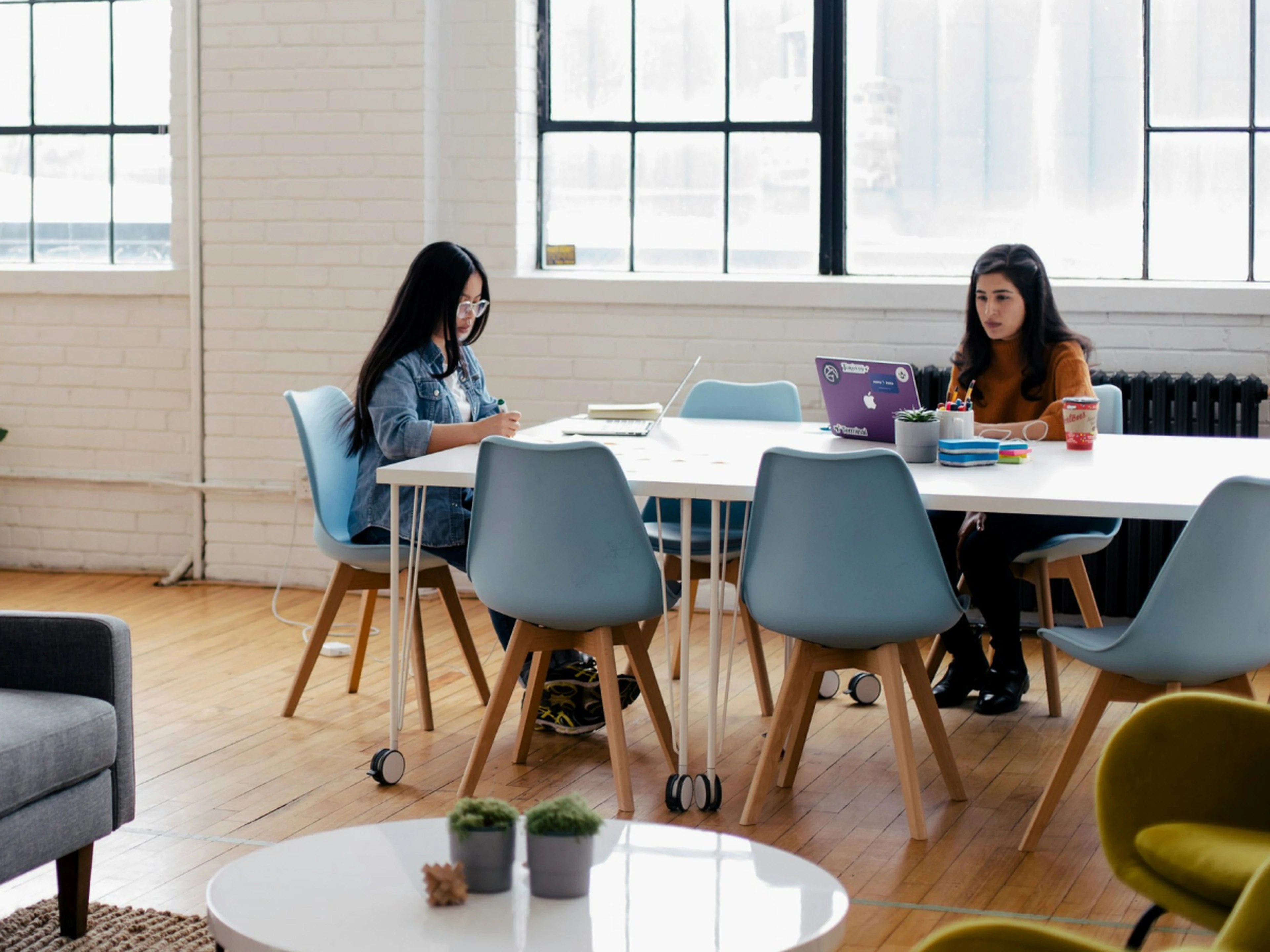 Two people working together at a desk