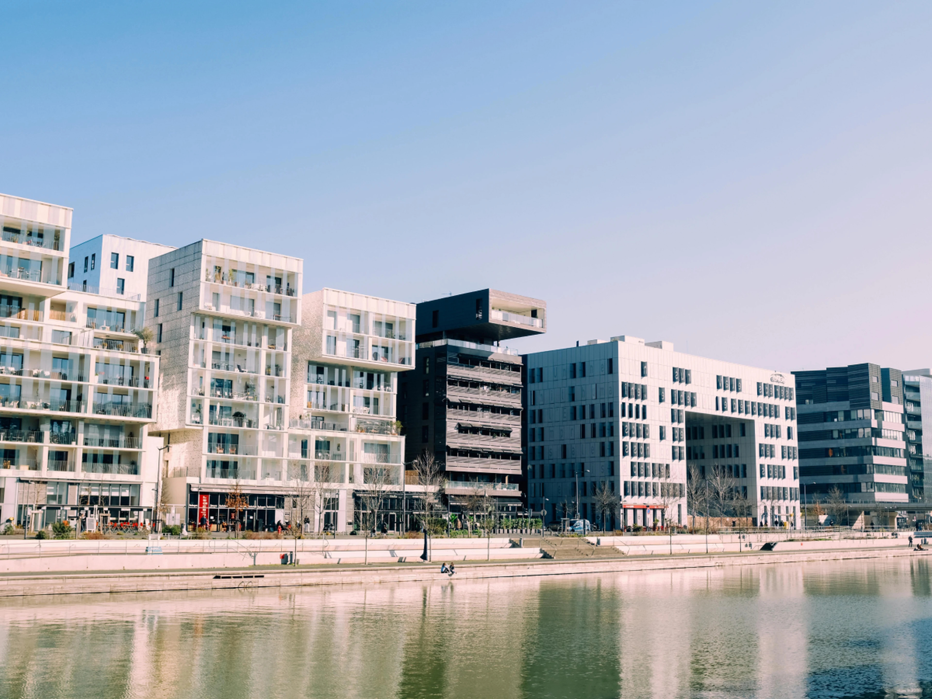 Multiple hotel buildings near a river