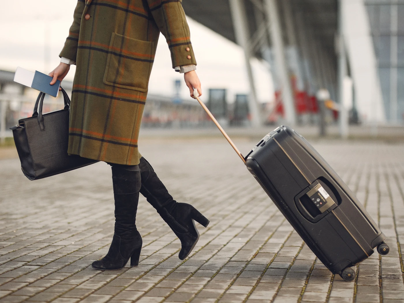 traveler with a suitcase walking past