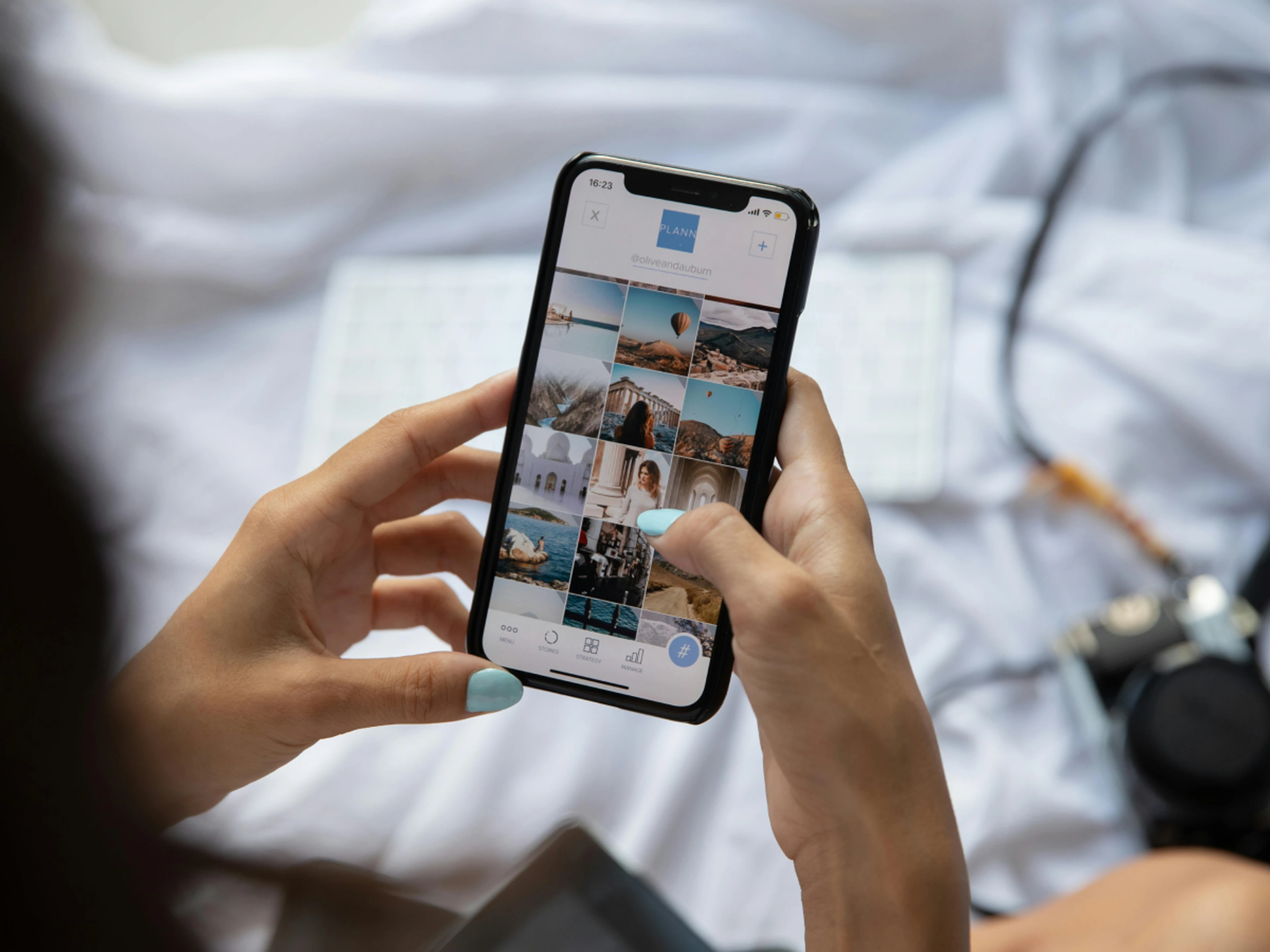 Person scrolling through travel photos on a smartphone
