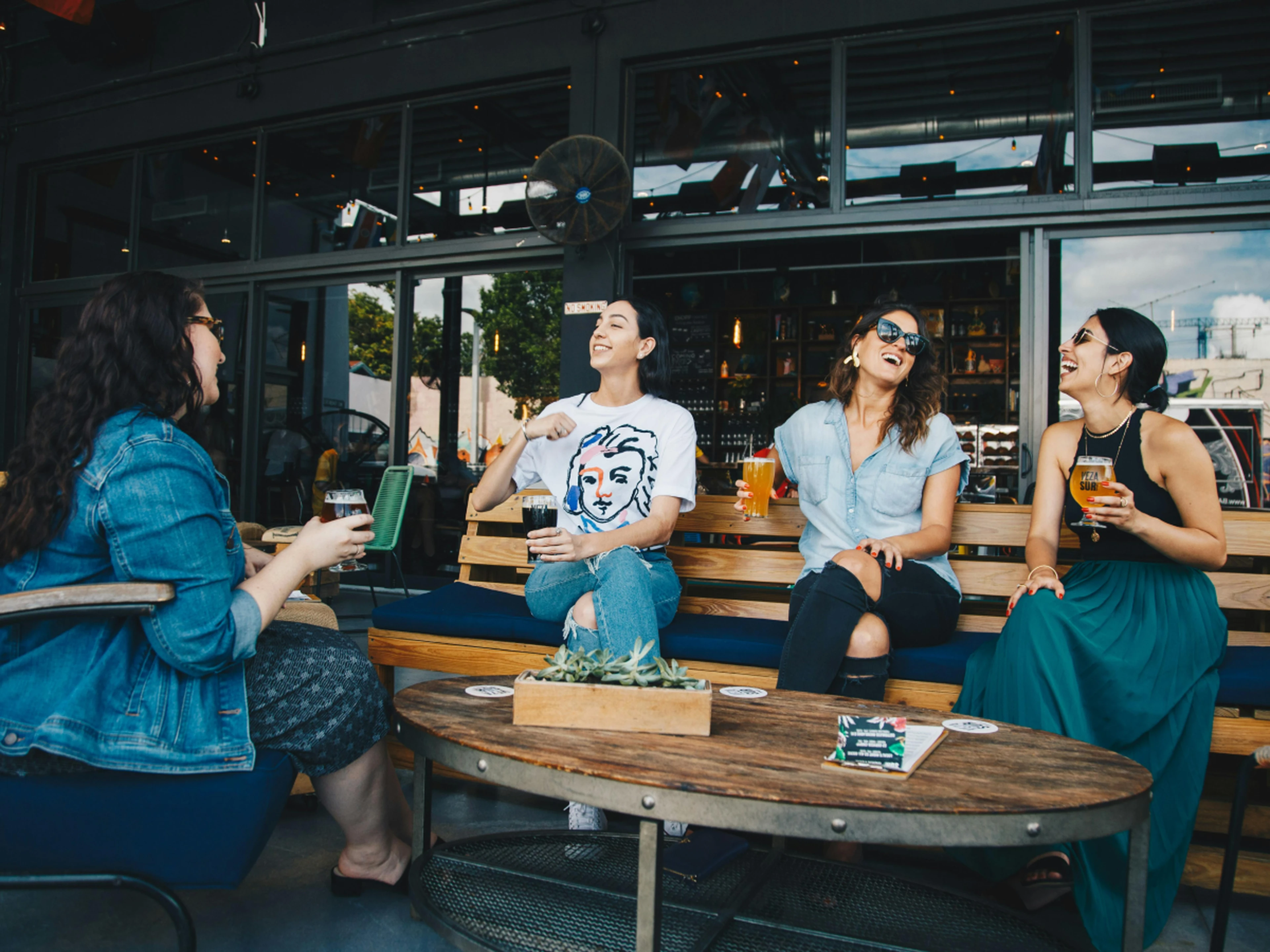A group of people having a drink at a bar