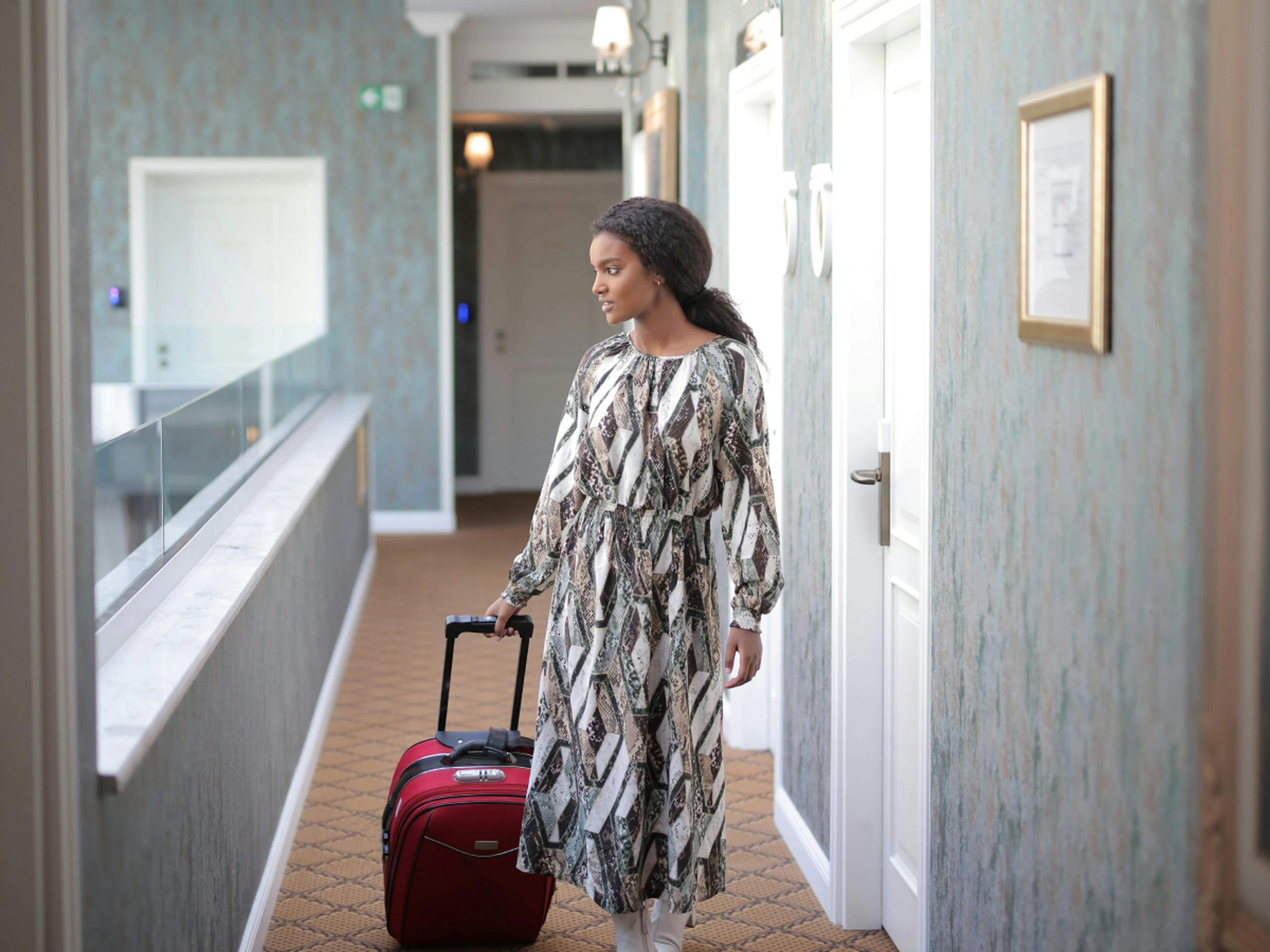 traveler with suitcase arriving at hotel