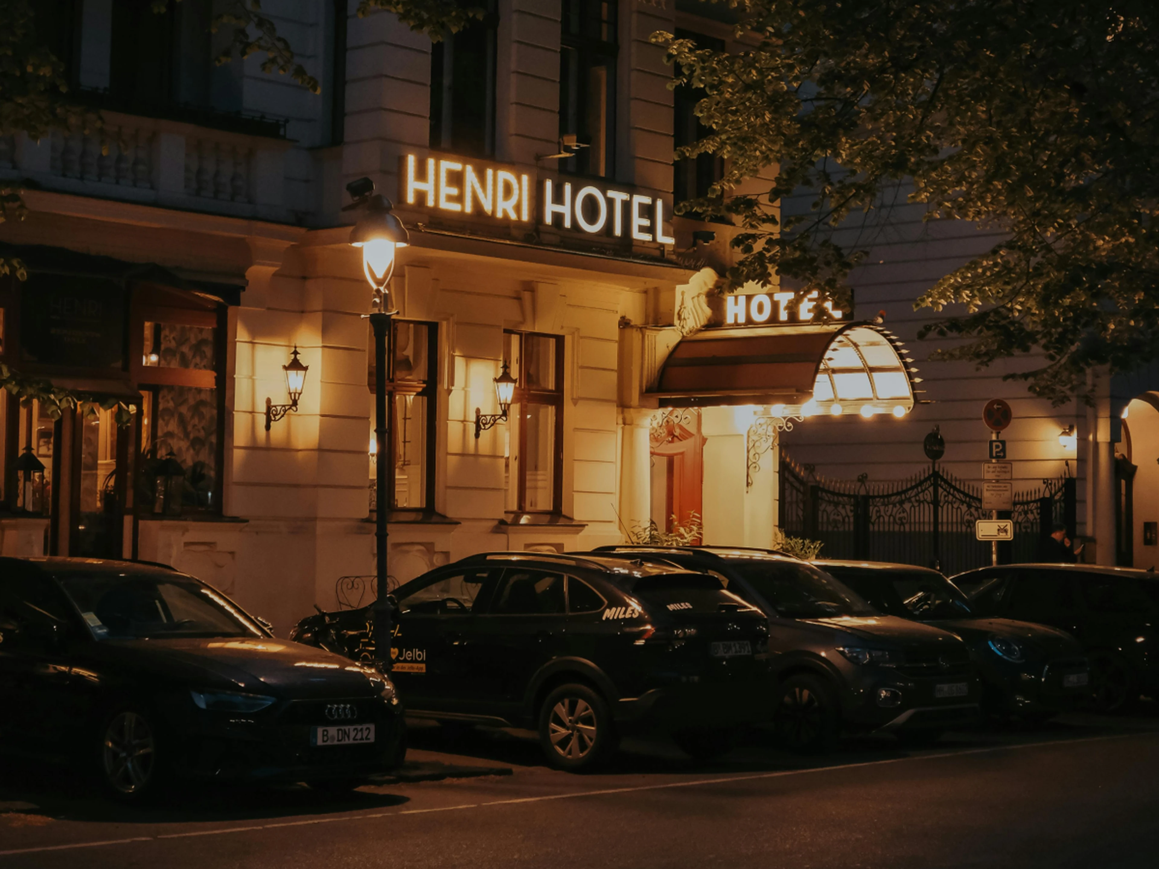 street view with a fancy-looking boutique hotel at night
