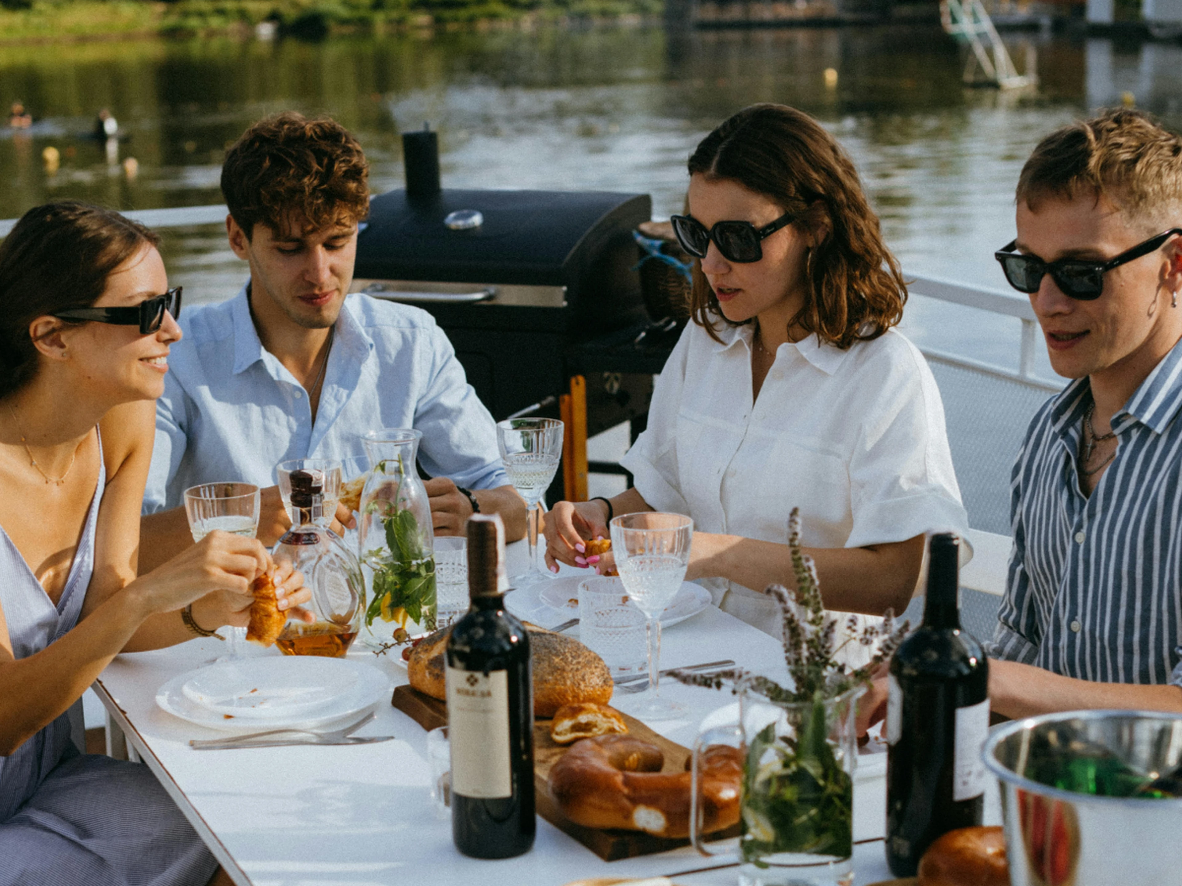 friend group having lunch on a boat on holiday
