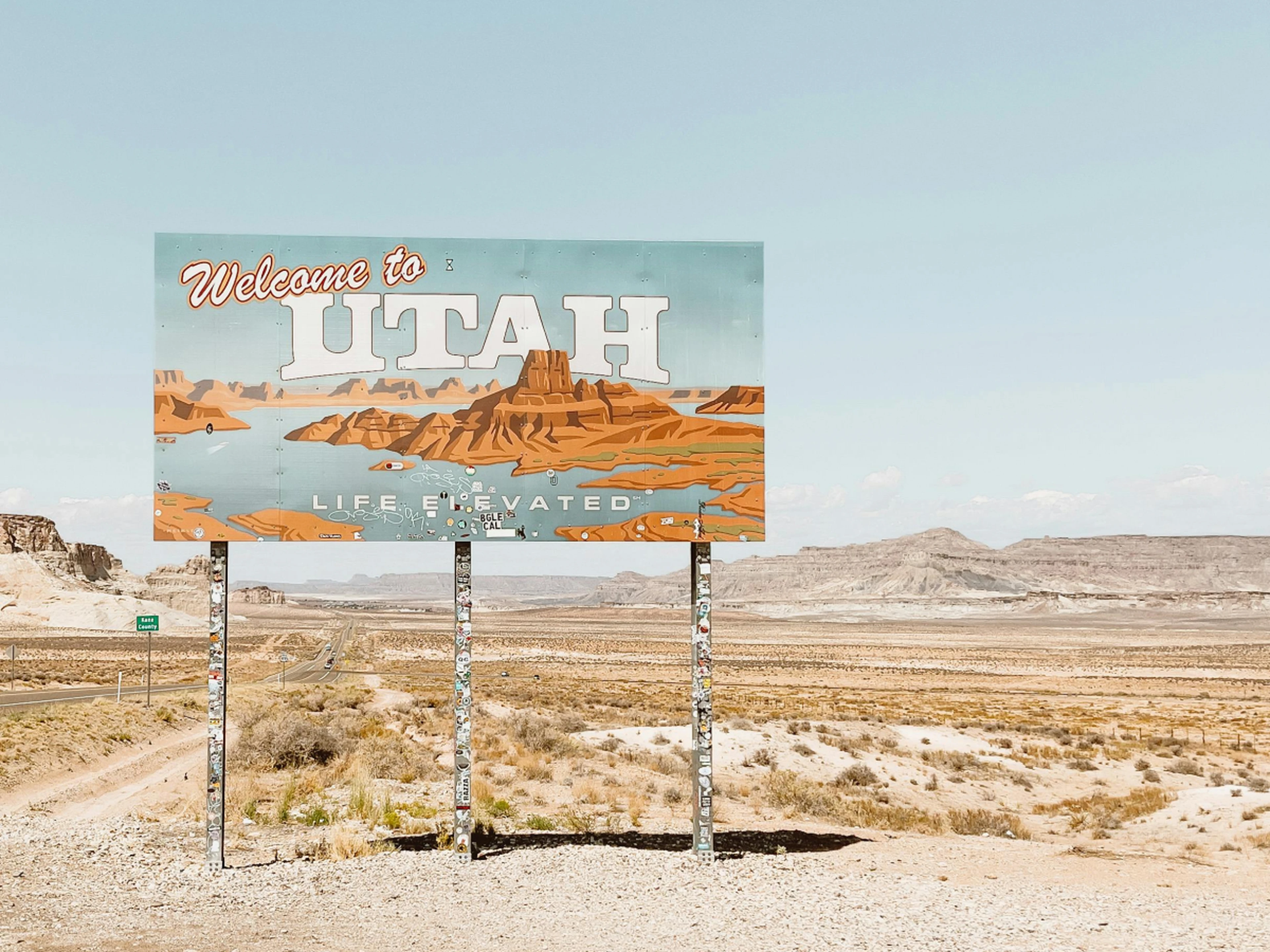 State of Utah welcome sign in a desert landscape