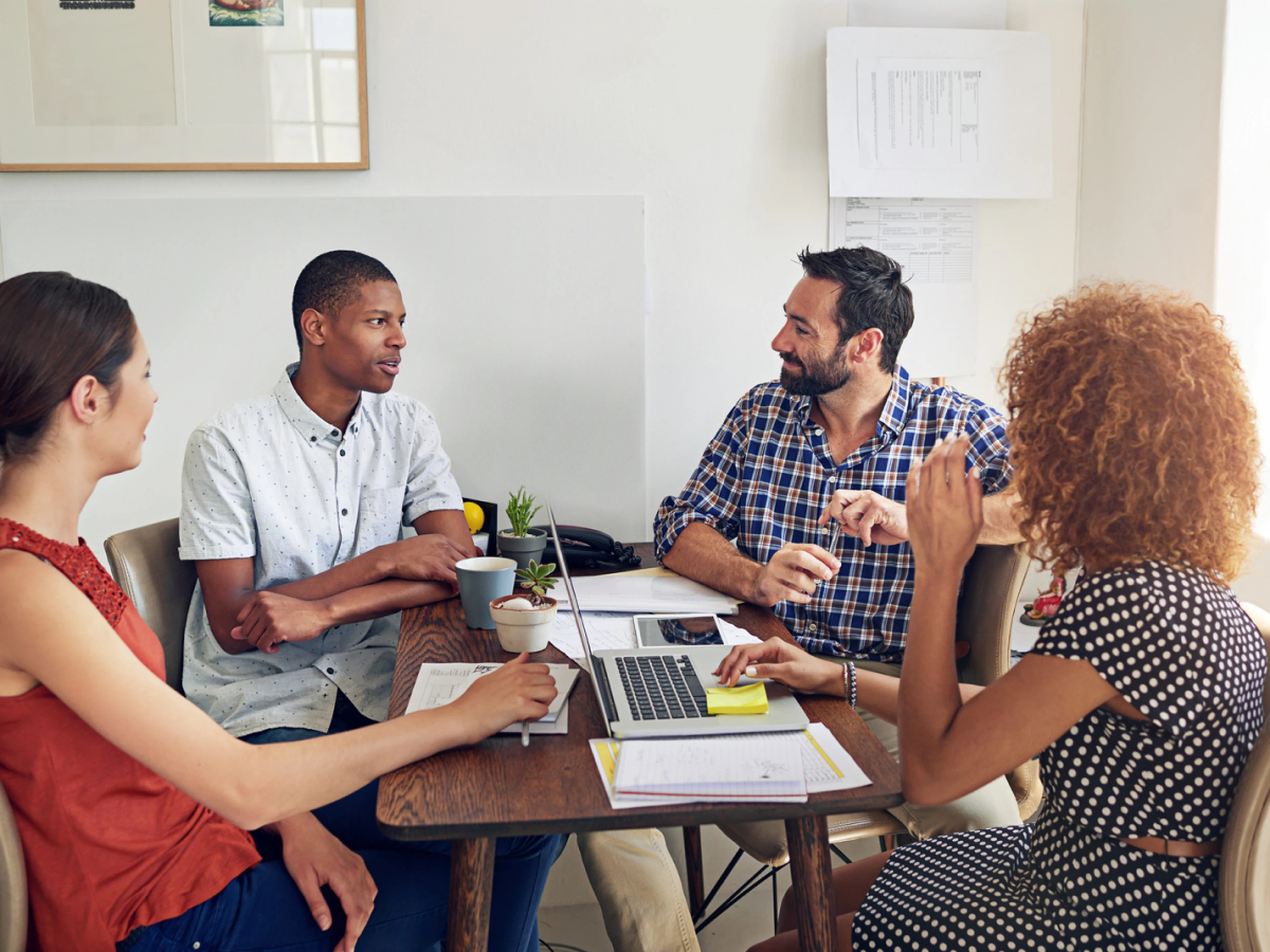 team discussing something during a meeting