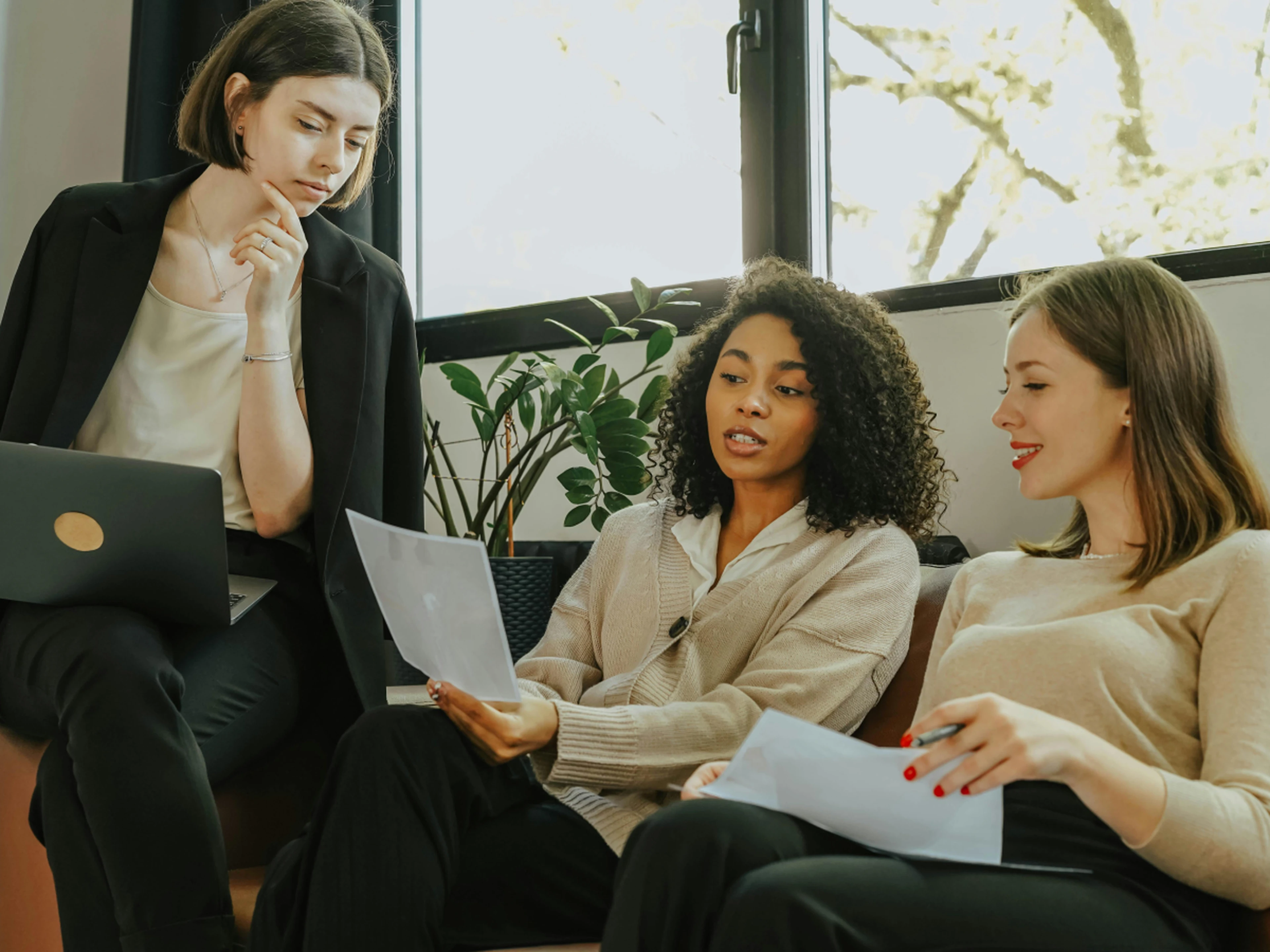 group of coworkers looking at numbers