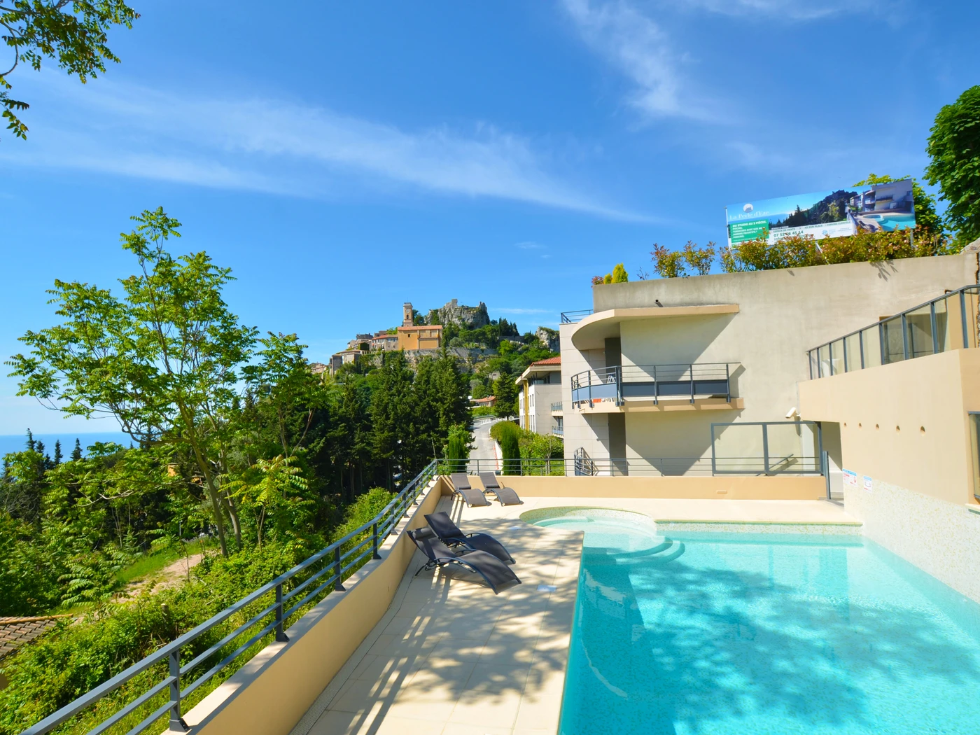 Outdoor image of La Perle d'Eze with swimming pool and lounge chairs