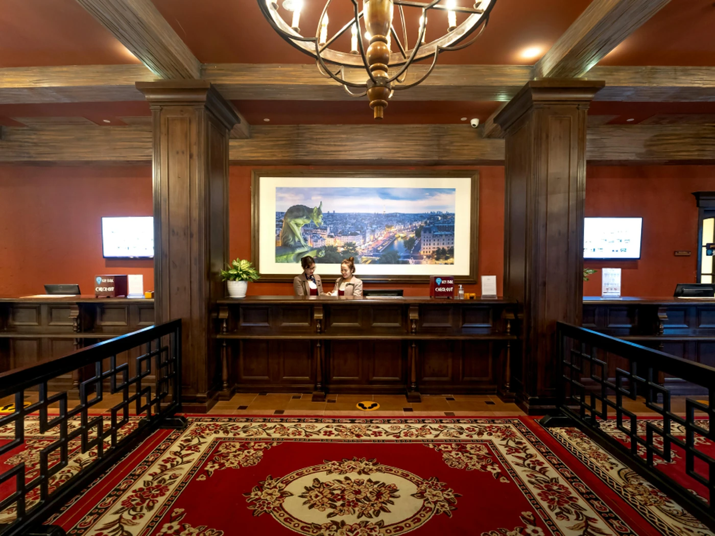 Hotel staff at the front desk of a hotel