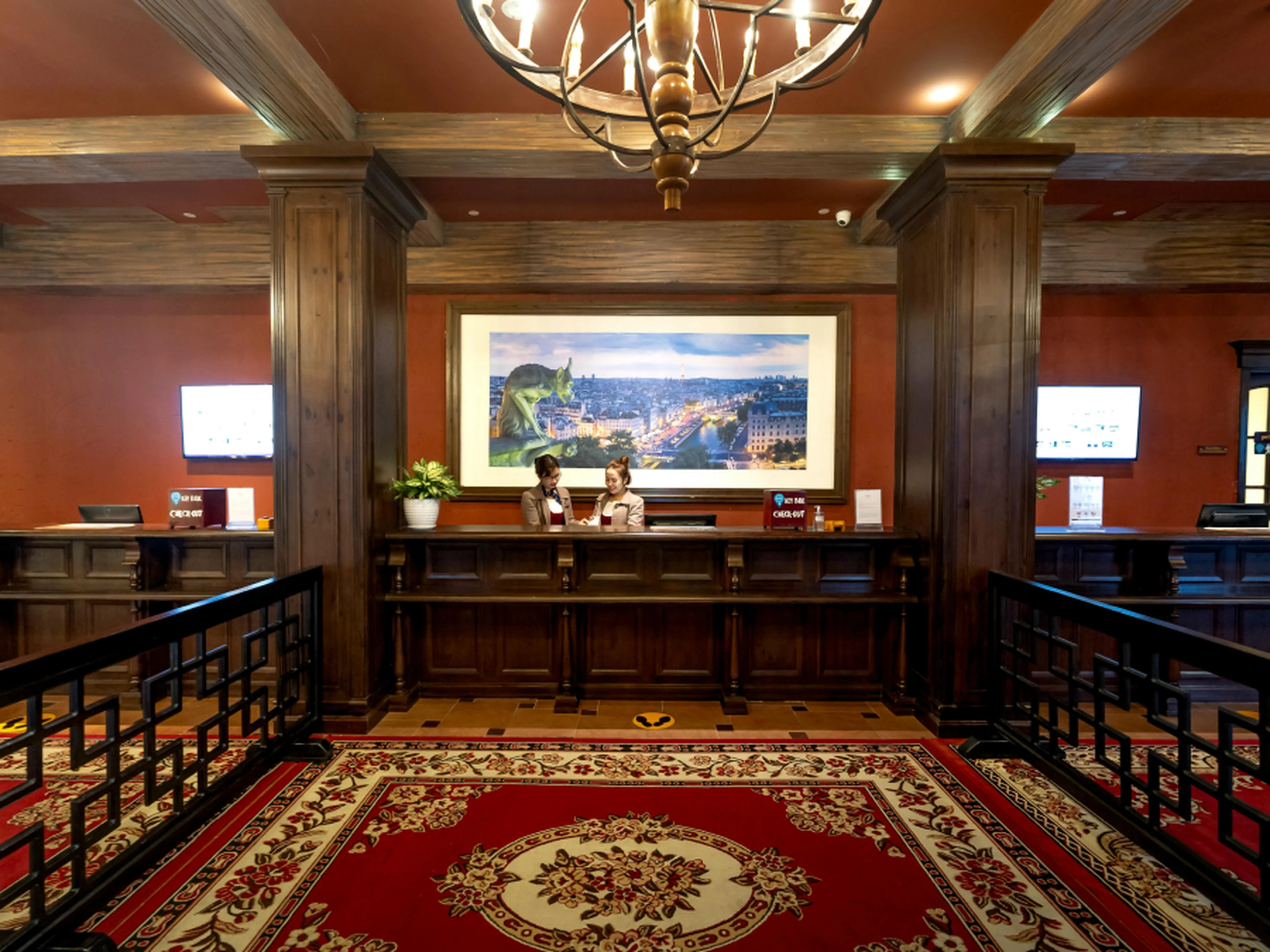 Hotel staff at the front desk of a hotel