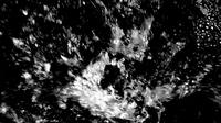 Chaotic splashes of water in black and white, creating dynamic patterns and textures with high contrast and movement.