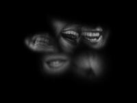 Several grinning mouths are scattered against a black background.