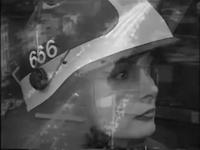 Black and white image of a young woman with a helmet. Double exposure with an image of a street.