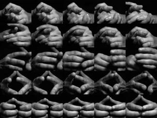 A grid of black and white photos showing various hand gestures and positions against a dark background.