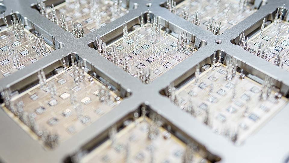 VINcoPress technology in the production, highlighting detailed electronic components.