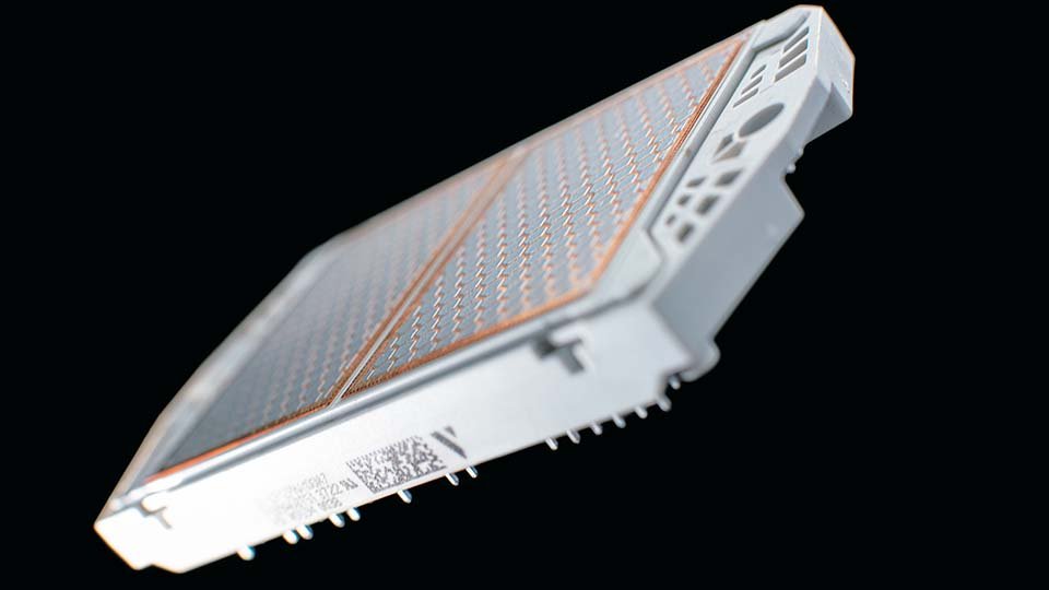 Close-up of a flow E3 with a grid pattern, angled against a black background.