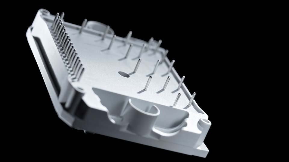 Close-up of flow 1C with multiple metallic pins protruding, set against a black background.