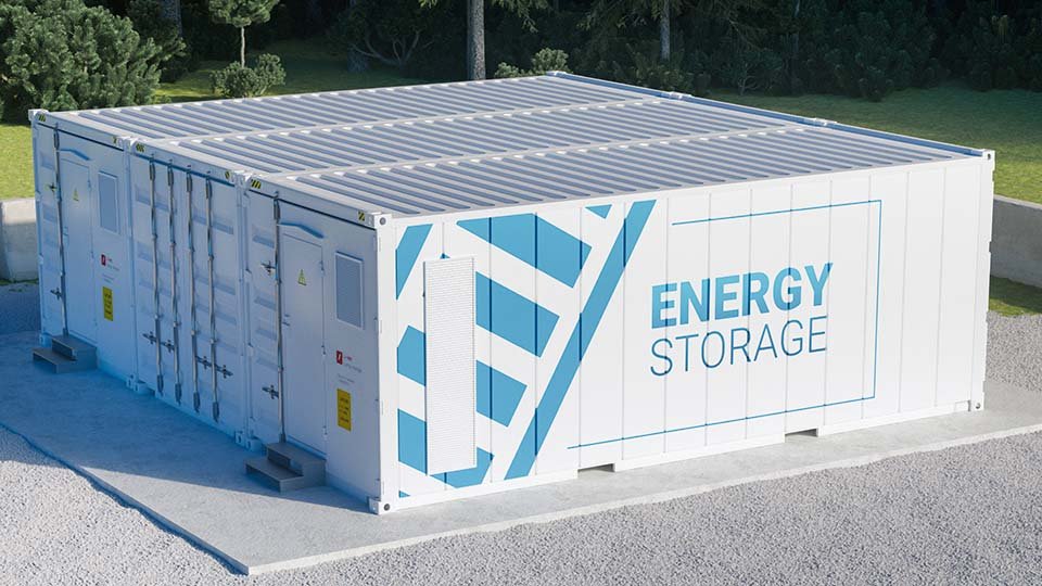 White rectangular energy storage container with blue design and labeled "Energy Storage," surrounded by greenery and set on a concrete pad.