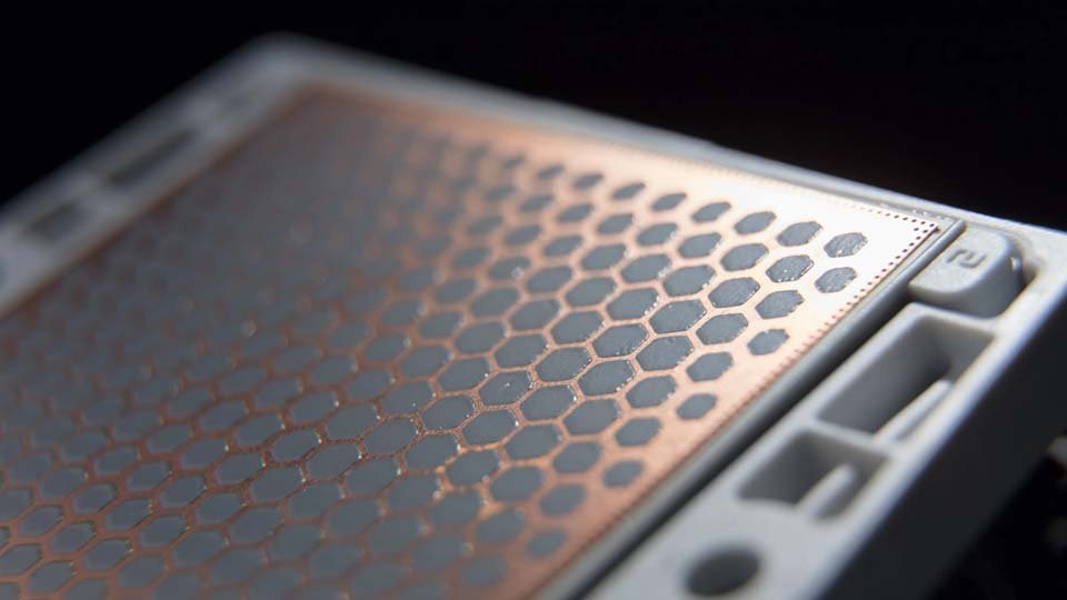 Power module with TIM surface on a black background.
