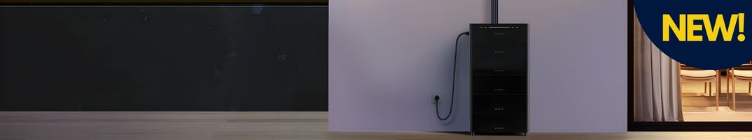 Modern residential all-in-one ESS tower by Marstek, plugged into a home wall outlet with multiple solar energy input cables connected to the top. The visual context features a dark starry night sky and a home interior with curtain folds. A dark navy blue circular badge with yellow text "NEW!" is overlaid in the top right corner.