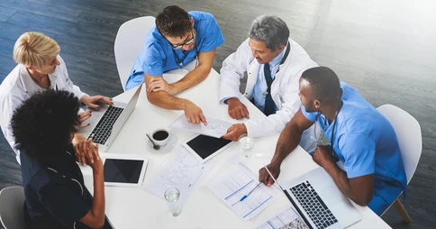 A group of experts discussing a case