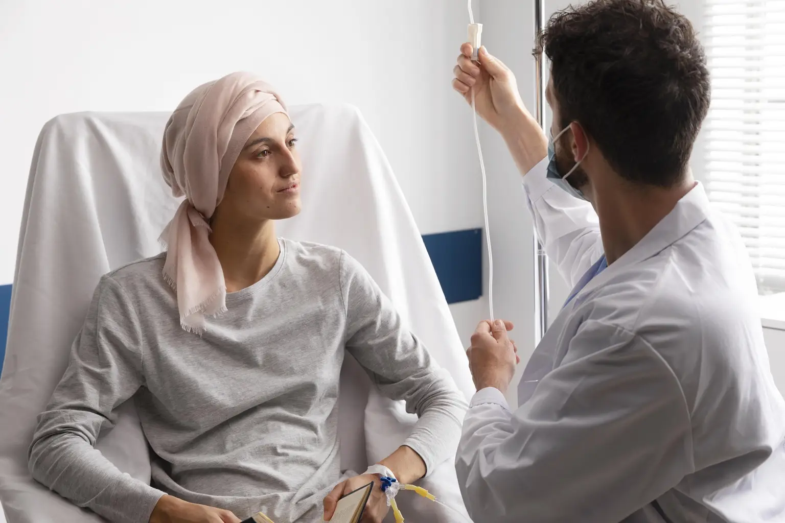 Medical staff taking care of a patient with cancer