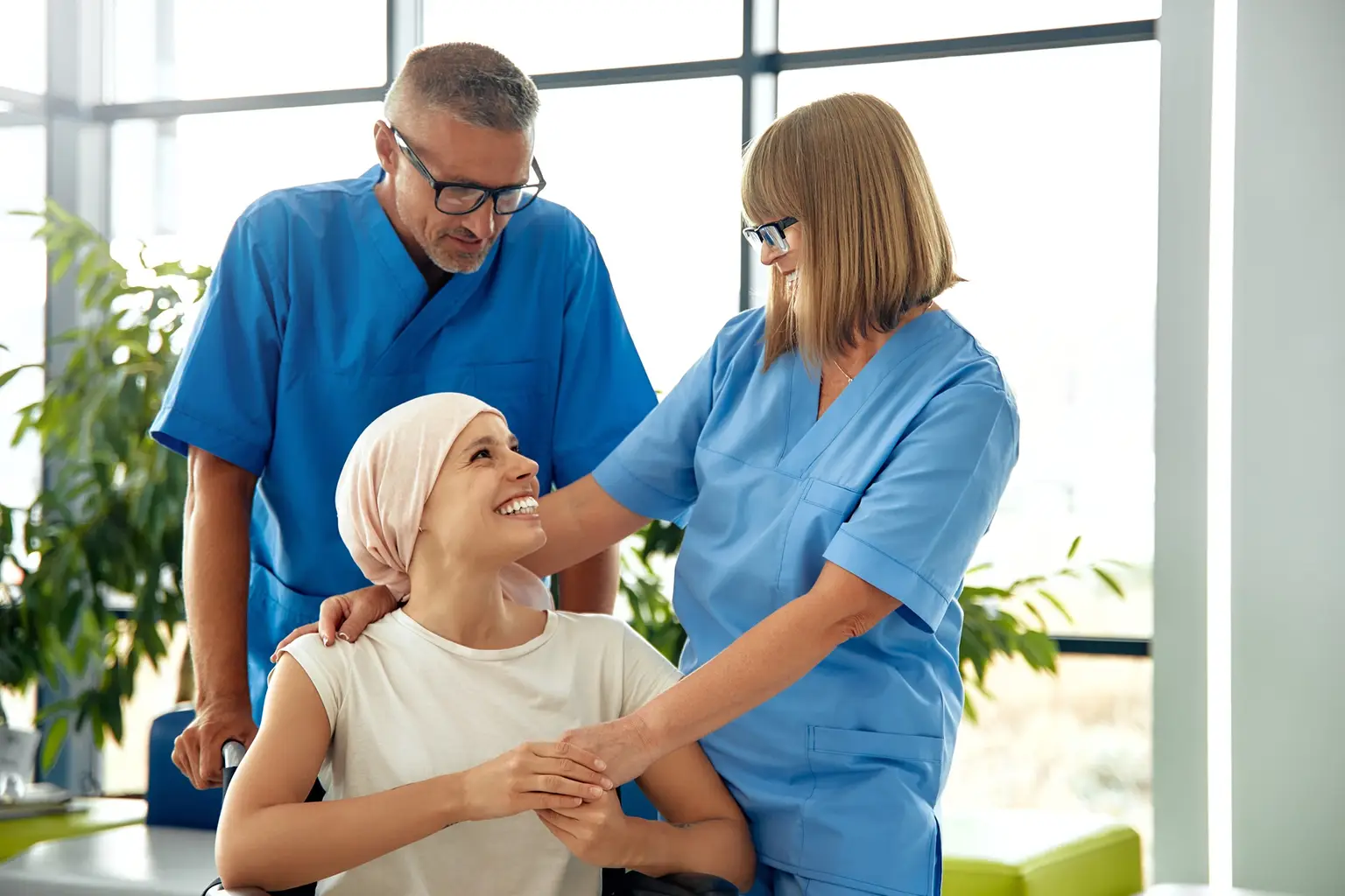 Woman with cancer surrounded by helpful medical stuff