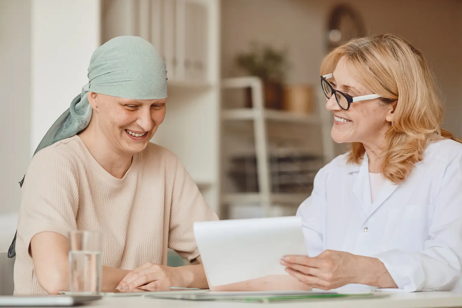 Woman with cancer discussing results with a doctor