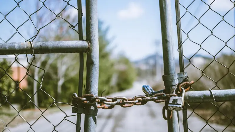 Chain-locked metal gate blocking a path
