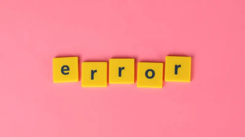 Yellow letter tiles spelling ERROR on a pink background
