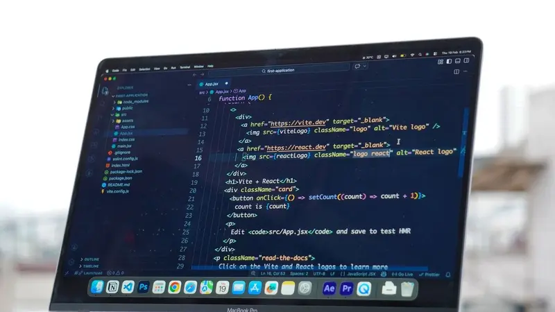 Laptop displaying lines of code on a desk