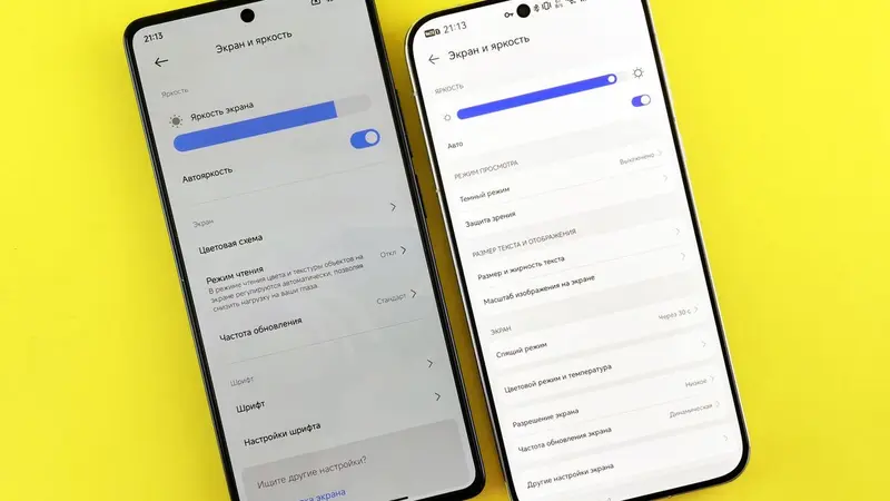 Two smartphones side by side on a yellow background