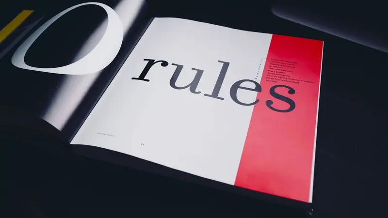 The word rules printed in italic serif type on a card
