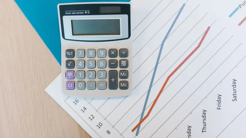 Calculator on a printed line chart