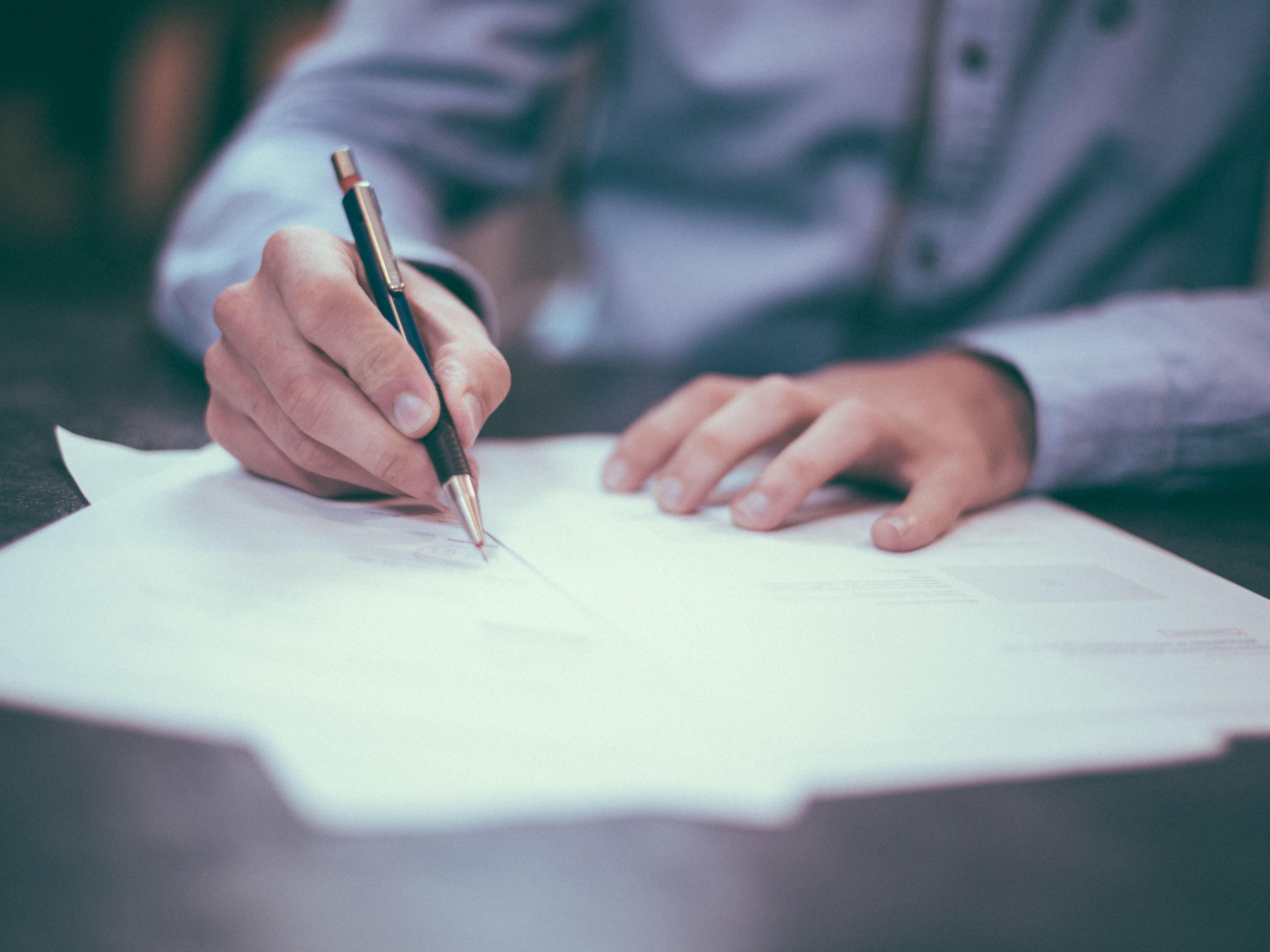 Man signing a document