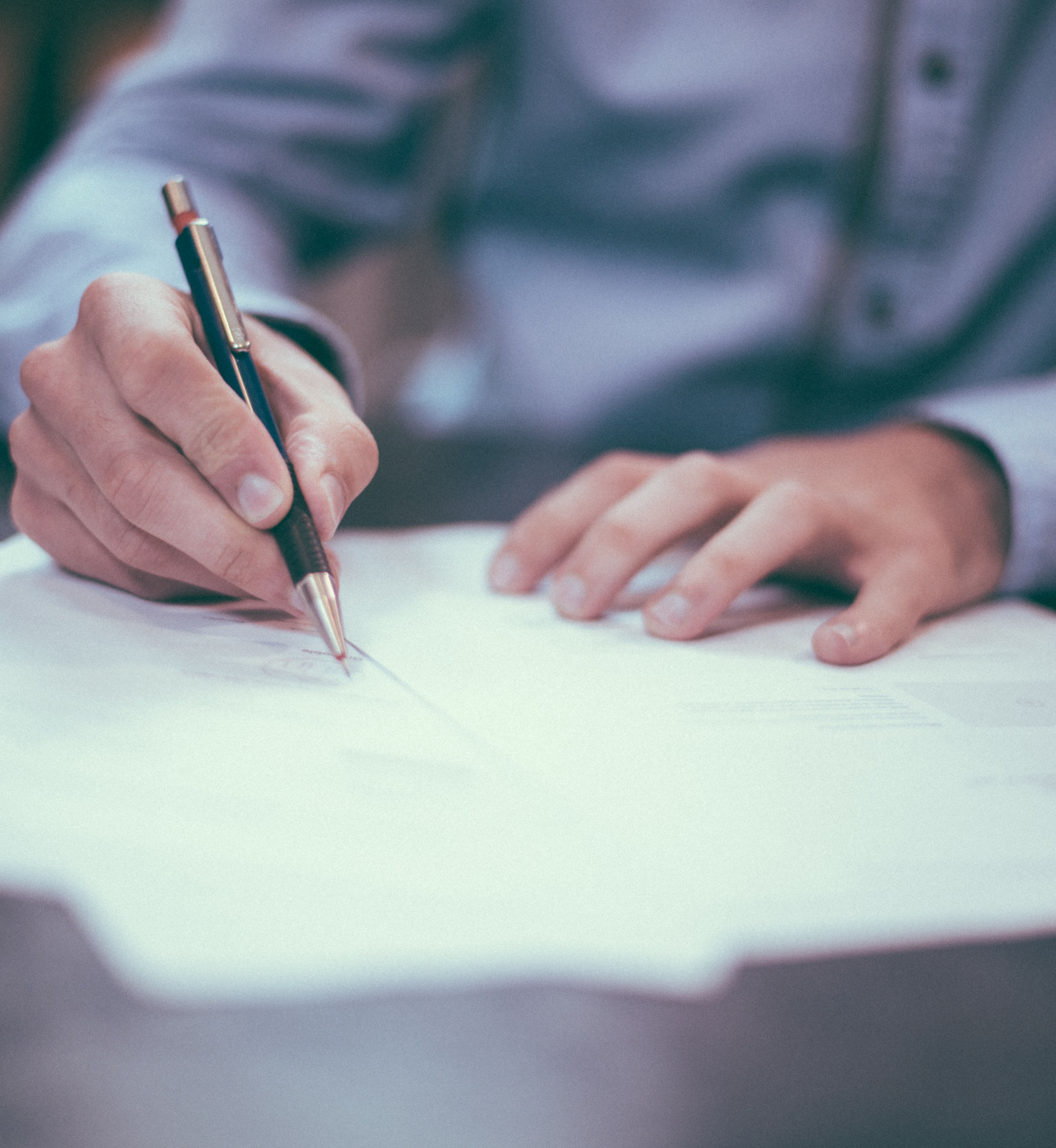 Man signing a document