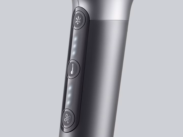 Close-up of Braun HD4.3 Hairdryer control switch with temperature and speed settings.