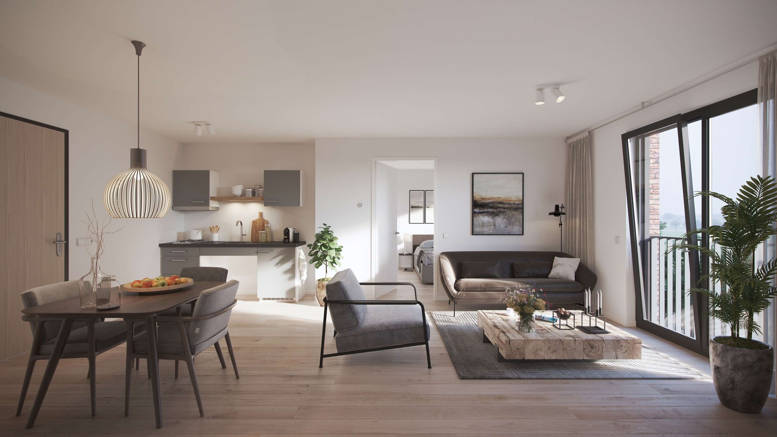 Bright modern open-plan living room and kitchen with dining table under pendant light, gray sofa, armchair, low wooden coffee table, balcony.