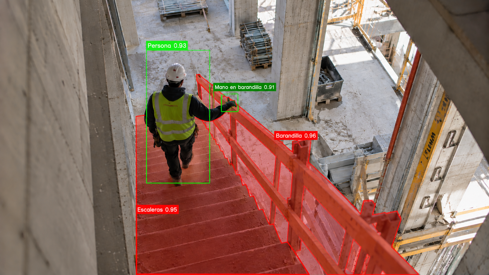 Trabajador con chaleco bajando una escalera en obra, con zona de riesgo marcada por Safe