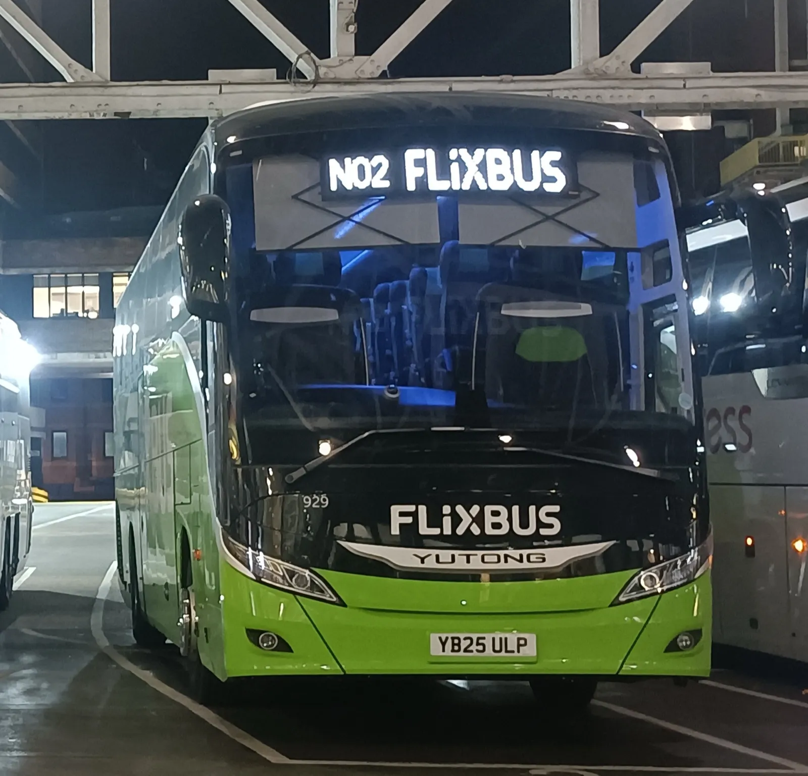 FlixBus Yutong coach at a depot at night