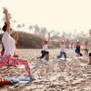 https://a.storyblok.com/f/289146571662634/1274x716/95eda9a513/beach-yoga.jpeg