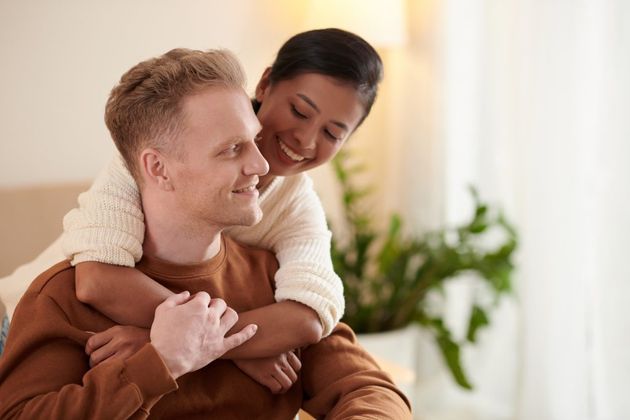 Happy woman embracing her boyfriend