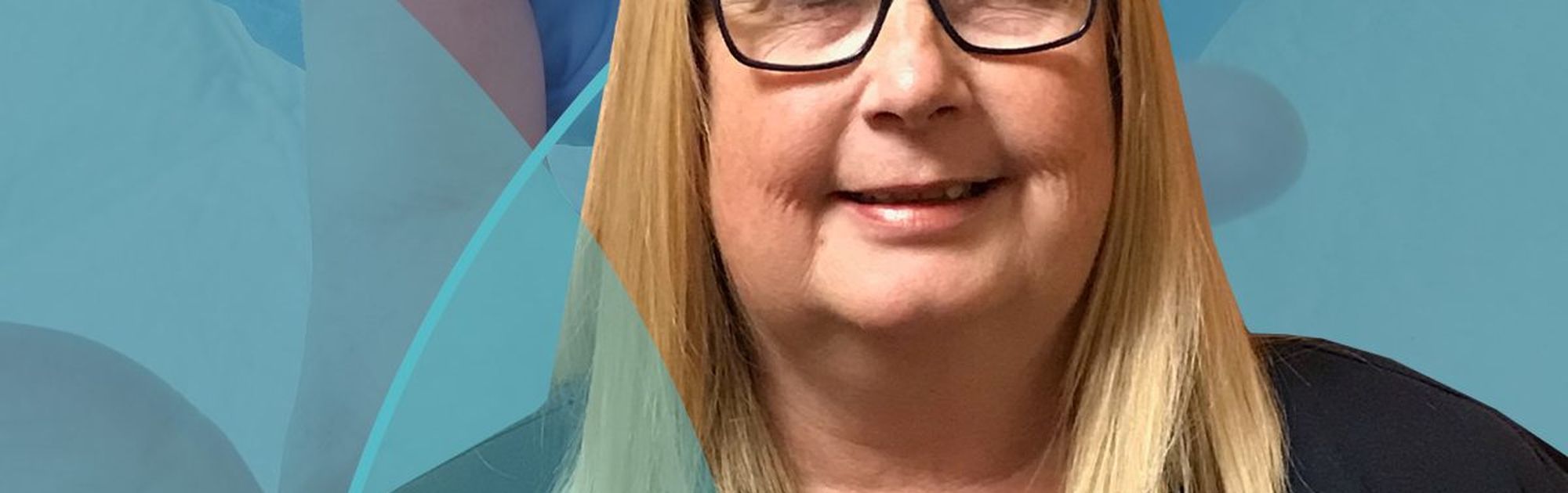 Smiling woman with glasses and blonde hair wearing a dark shirt, with medical-themed background elements.