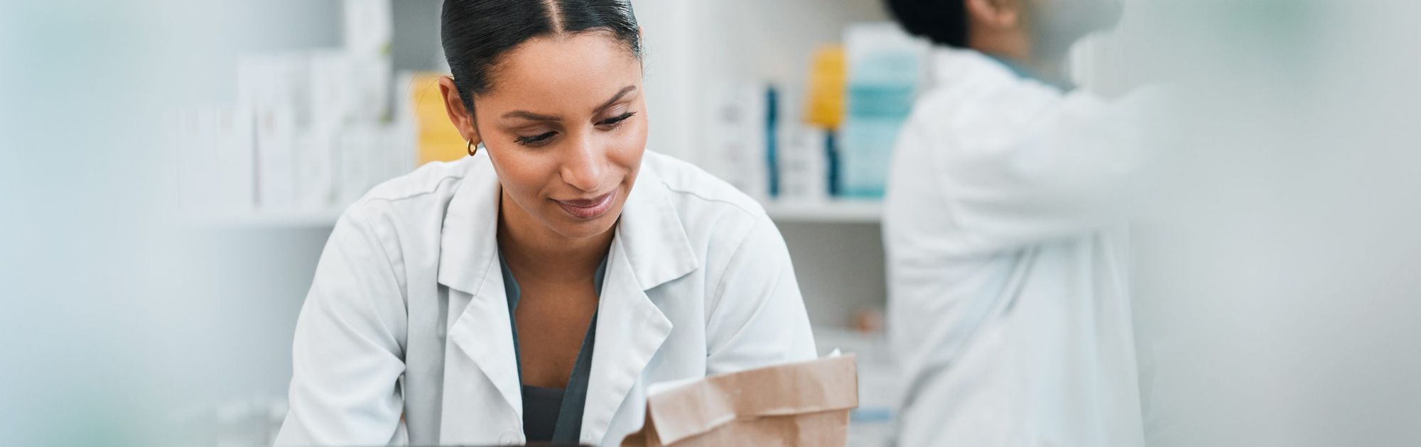 Pharmacist people and paper bag for medicine store