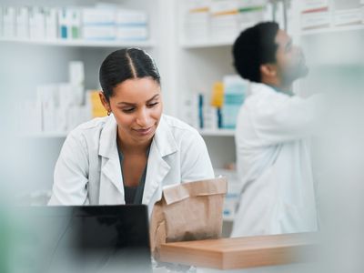 Pharmacist people and paper bag for medicine store