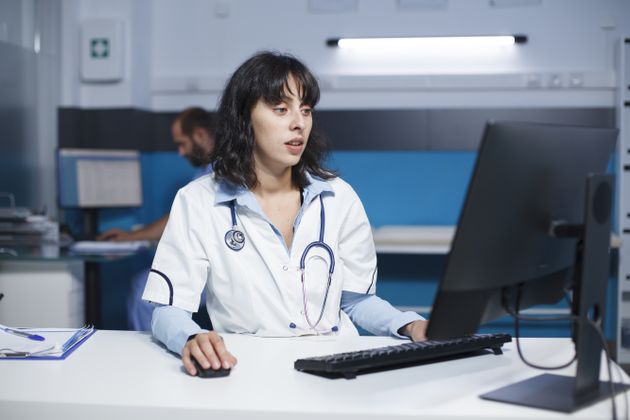 female doctor working on computer in hospital