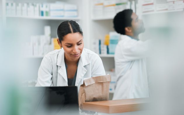 Pharmacist checking a medication bag